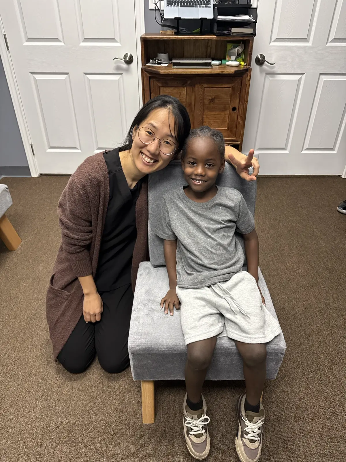 A parent and child during a gentle Brain Blossom visit at AlignLife Chiropractic